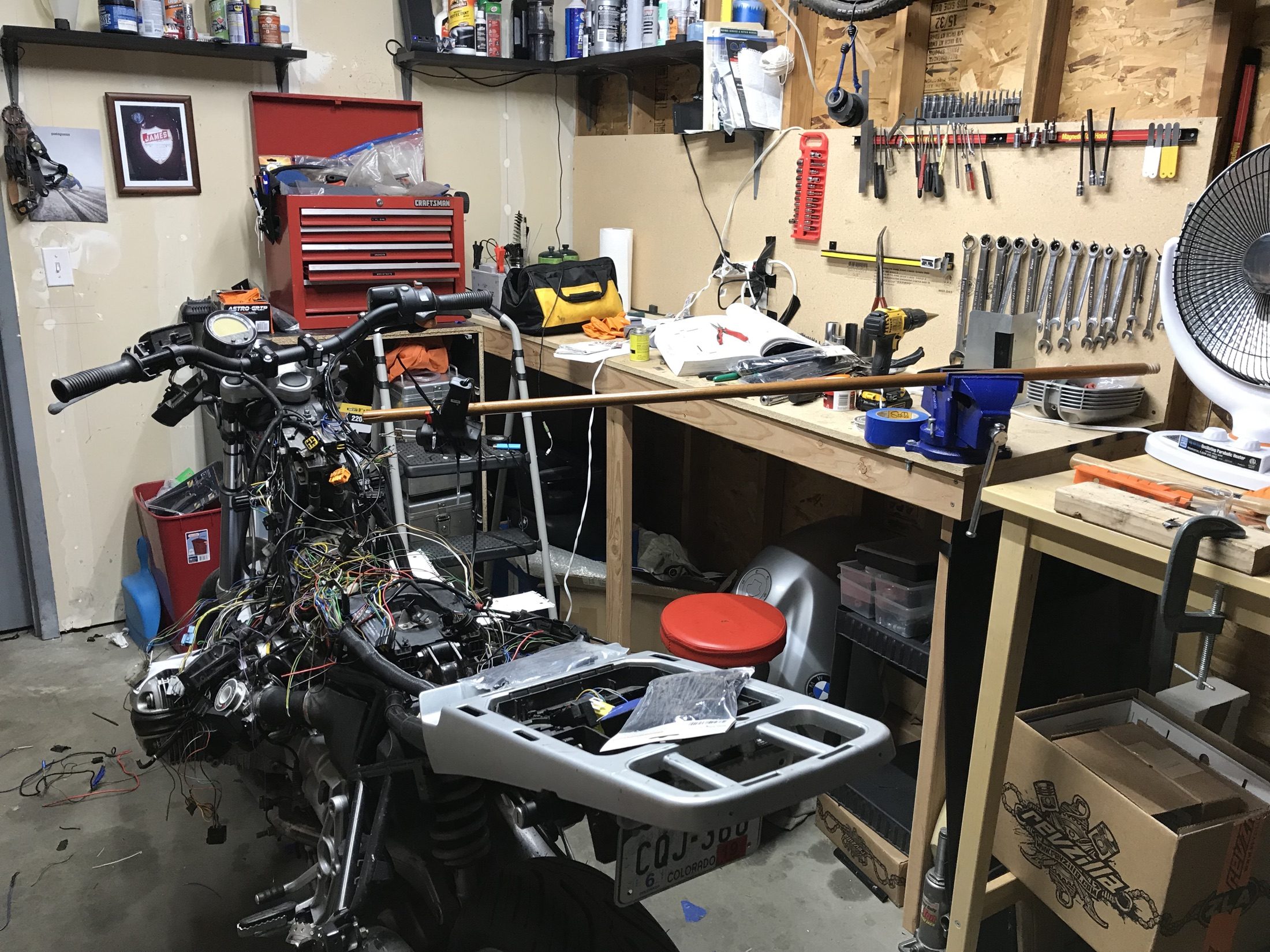 Dense custom motorcycle wiring during the BMW project