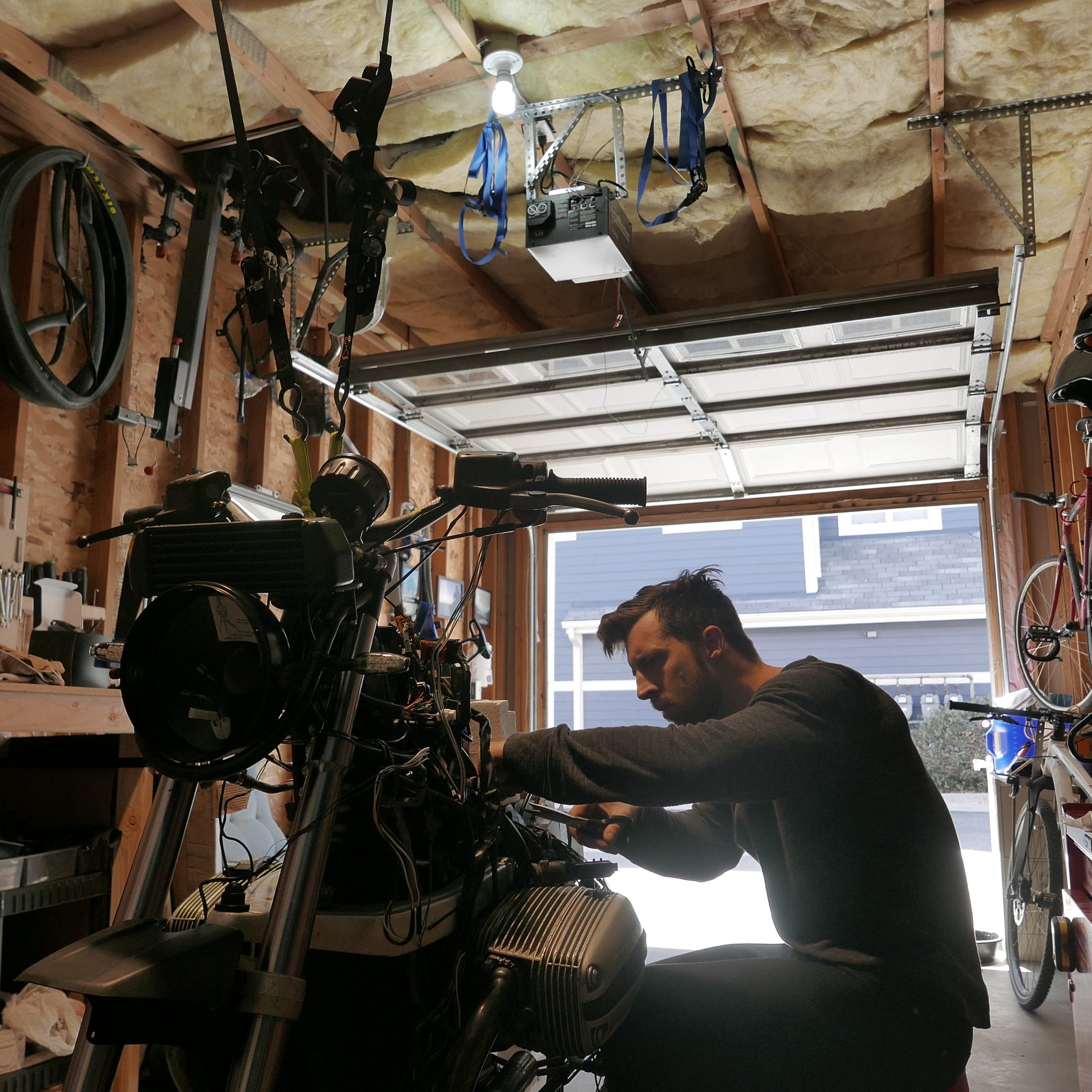 Jay working on a disassembled BMW motorcycle
