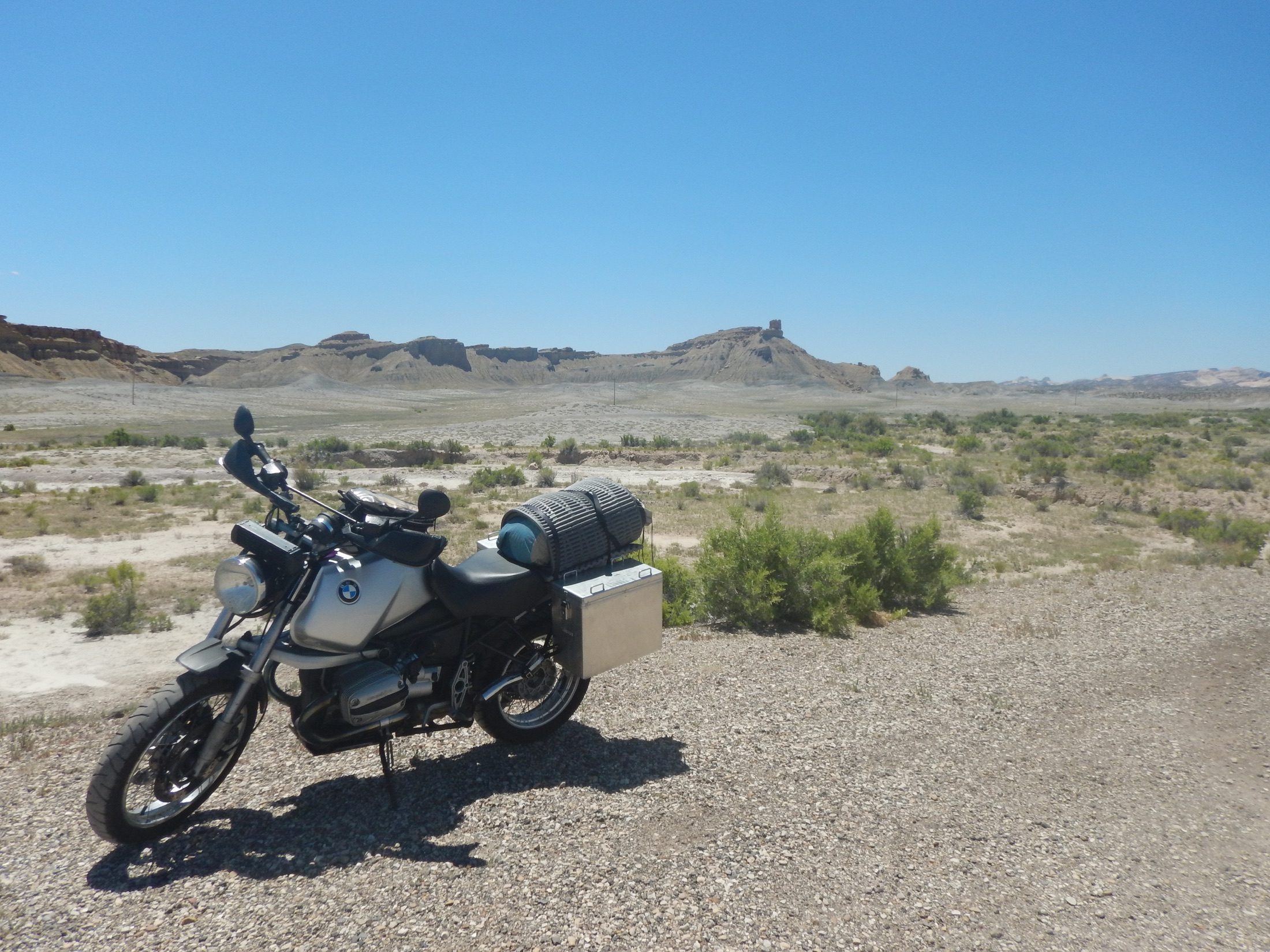 Loaded motorcycle parked in a desert landscape