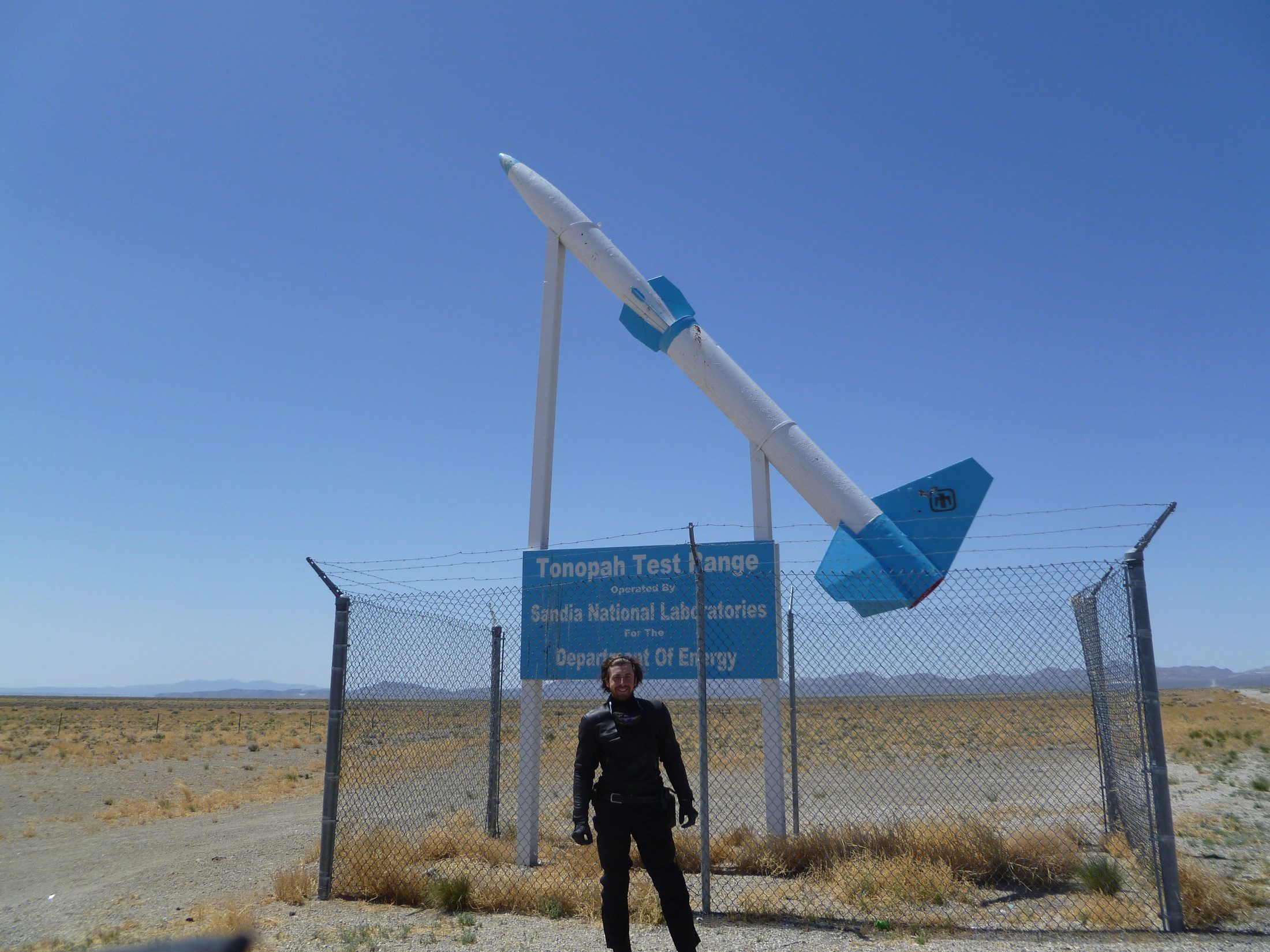 Jay beside a roadside missile display near Tonopah